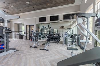 Fitness center with yoga studio, virtual trainer & towel service